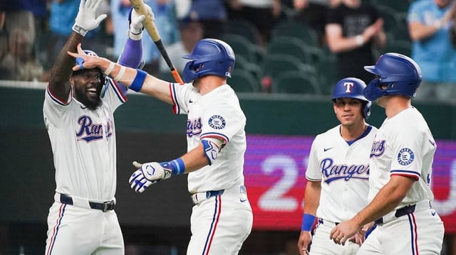 May 13, 2025; Arlington, Texas, USA; Texas Rangers third baseman Josh Jung (6) is greeted by outfielder Adolis García (53) after hitting a three-run home run scoring outfielder Sam Haggerty (0) and outfielder Evan Carter (32) during the first inning against the Colorado Rockies at Globe Life Field. Mandatory Credit: Raymond Carlin III-Imagn Images