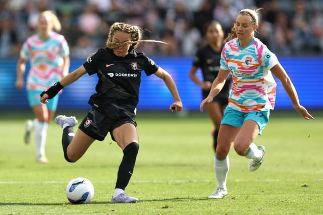 ACFC defender Savy King, left, kicks the ball during an NWSL match against San Diego Wave FC on Sunday, March 16, 2025, at BMO Stadium. (Photo by Raul Romero Jr., Contributing Photographer)