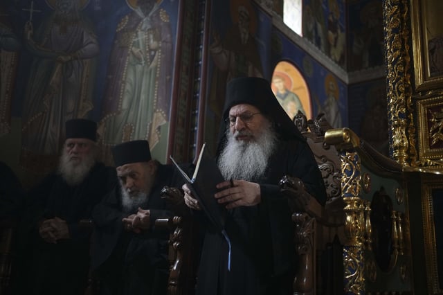 Archimandrite Eliseos, the abbot of Simonopetra, or Simonos Petra Monastery, prays during the afternoon liturgy at the all-male autonomous community of Agion Oros, or Holy Mountain, on the peninsula of Mount Athos in northern Greece, Monday, April 14, 2025. (AP Photo/Thanassis Stavrakis)
