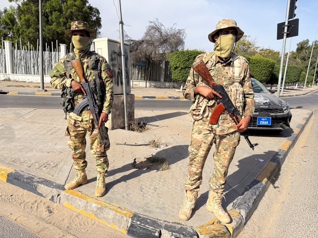 Members of the 444 Brigade of the Libyan Army, a unit serving the Government of National Unity (GNU) and Prime Minister Abdulhamid al-Dbeibah, stand guard at Abu Salim area, in Tripoli, Libya, May 13, 2025.  REUTERS/Ayman al-Sahili/File Photo