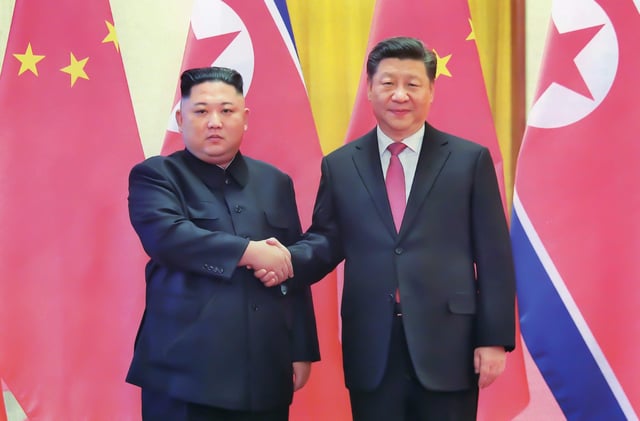 North Korean leader Kim Jong Un and Chinese President X Jinping during a 2018 visit.
