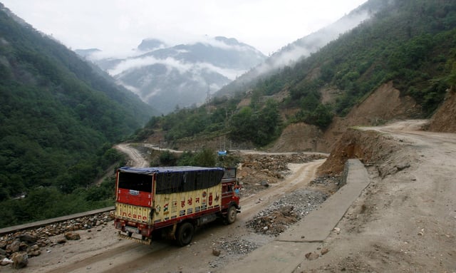 A liquefied petroleum gas (LPG) delivery truck drives along India's Tezpur-Tawang highway which runs to the Chinese border, in the northeastern Indian state of Arunachal Pradesh May 29, 2012./File Photo