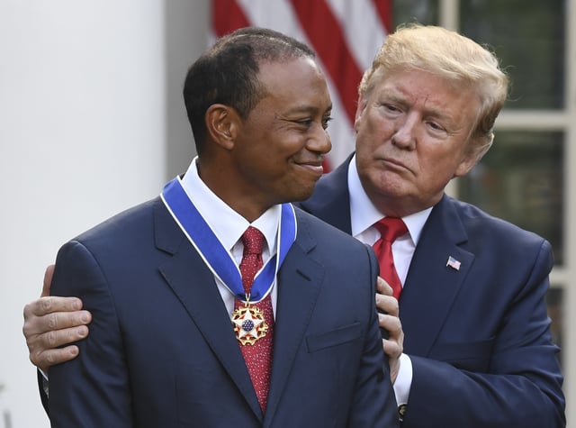 US President Donald Trump presents US golfer Tiger Woods with the Presidential Medal of Freedom during a ceremony in the Rose Garden of the White House in Washington, DC, on May 6, 2019. (Photo by SAUL LOEB / AFP) (Photo credit should read SAUL LOEB/AFP via Getty Images)