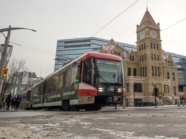 A CTrain passes city hall on 7th Avenue S. in Calgary on Tuesday, December 7, 2021.
