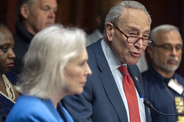 Senate Minority Leader Chuck Schumer, of N.Y., right, speaks as Sen. Kirsten Gillibrand, D-N.Y., left, listens during a news conference to protest cuts in the World Trade Center Health Program on Capitol Hill, Tuesday, May 13, 2025, in Washington. (AP Photo/Mark Schiefelbein)