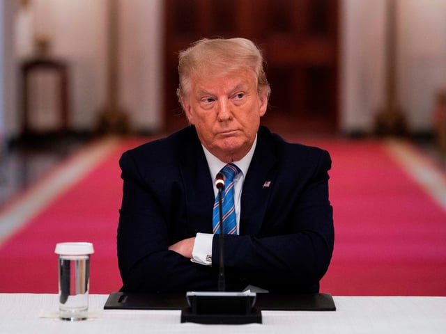 OPSHOT - US President Donald Trump sits with his arms crossed during a roundtable discussion on the Safe Reopening of Americas Schools during the coronavirus pandemic, in the East Room of the White House on July 7, 2020, in Washington, DC. (Photo by JIM WATSON / AFP) (Photo by JIM WATSON/AFP via Getty Images)
