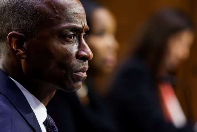 Fed Governor Philip Jefferson, nominated to be the Federal Reserve's next vice chair, testifies next to Federal Reserve Board governor nominees Lisa Cook and Adriana Kugler during a Senate Banking Committee nominations hearing on Capitol Hill in Washington, U.S., June 21, 2023. REUTERS/Jonathan Ernst/File photo