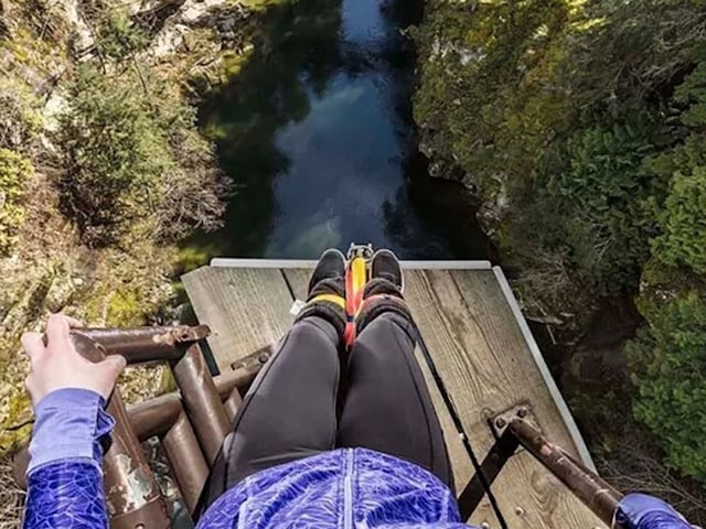 A bungee jumper readies to jump. 