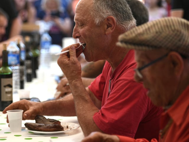 A man eats duck breast ('magret') in Saramon, southwestern France, on May 17, 2022 during the "world championship of duck breast eaters". - Thirteen people took part in the "world championship of duck breast eaters", as part of the duck breast fair. (Photo by Valentine CHAPUIS / AFP) (Photo by VALENTINE CHAPUIS/AFP via Getty Images)