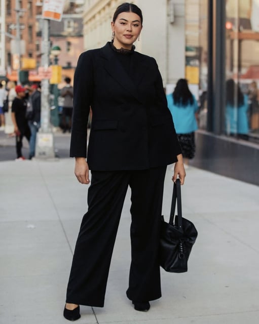 NEW YORK, NEW YORK - SEPTEMBER 11: Model and Herring designer Lauren Chan wears a black blazer, black trousers, and black leather Loewe bag after the Jonathan Simkhai show on September 11, 2021 in New York City. (Photo by Melodie Jeng/Getty Images)
