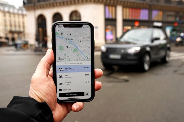 A photo Illustration shows the Uber application on a mobile phone in in central Paris, France March 5, 2020. REUTERS/Gonzalo Fuentes/File Photo