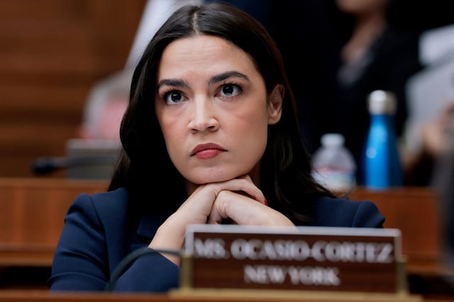 WASHINGTON, DC - MAY 13: Rep. Alexandria Ocasio-Cortez (D-NY) listens during a mark up meeting with the House Committee on Energy and Commerce committee on Capitol Hill on May 13, 2025 in Washington, DC. The committee met to discuss legislative recommendations for budget reconciliation. The committee room was surrounded by protesters fearing cuts or increased costs to medicaid. (Photo by Anna Moneymaker/Getty Images)