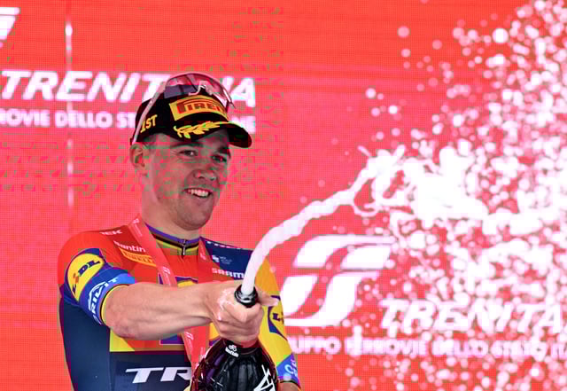 Cycling - Giro d'Italia - Stage 5 - Ceglie Messapica to Matera - Italy - May 14, 2025 Lidl - Trek's Mads Pedersen celebrates on the podium after winning stage 5 REUTERS/Jennifer Lorenzini