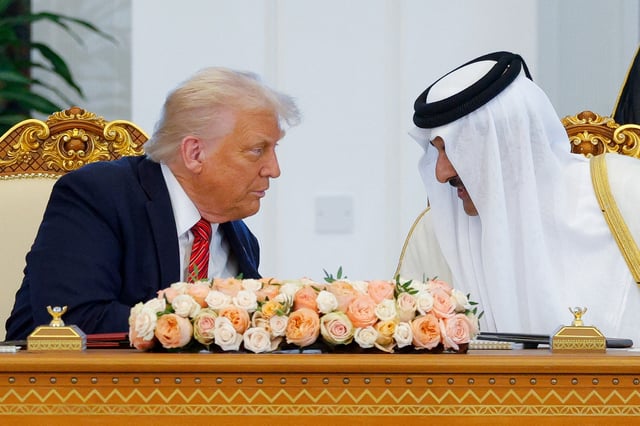 U.S. President Donald Trump and Qatar's Emir Tamim bin Hamad Al Thani attend a signing ceremony in Doha, Qatar, May 14, 2025. REUTERS/Brian Snyder