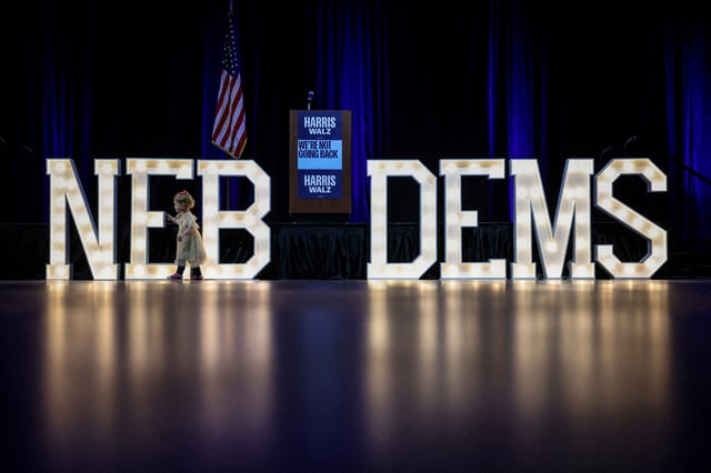 Logan Bodendorfer, 2, of Omaha, plays with decorations as Democratic supporters gather for the Nebraska Democrats Election Night Party in Omaha, Nebraska, U.S., November 5, 2024.