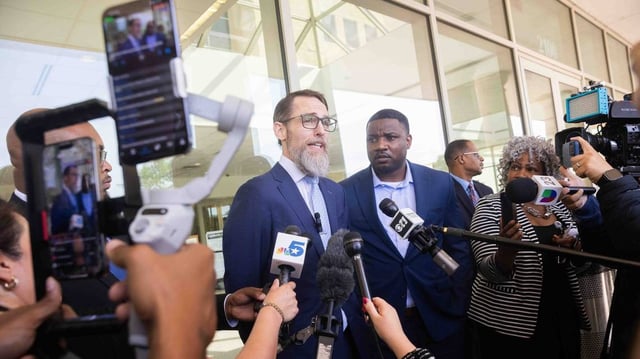 From left, Mike Howard, attorney for Karmelo Anthony, speaks to reporters as Dominique Alexander, president and CEO of Next Generation Action Network, stands next to him following a bond hearing in Anthony’s case at the Collin County Courthouse in McKinney, Texas, on Monday, April 14, 2025. Karmelo Anthony, 17, a Frisco Centennial High School student and football player, is accused of stabbing Austin Metcalf, also 17