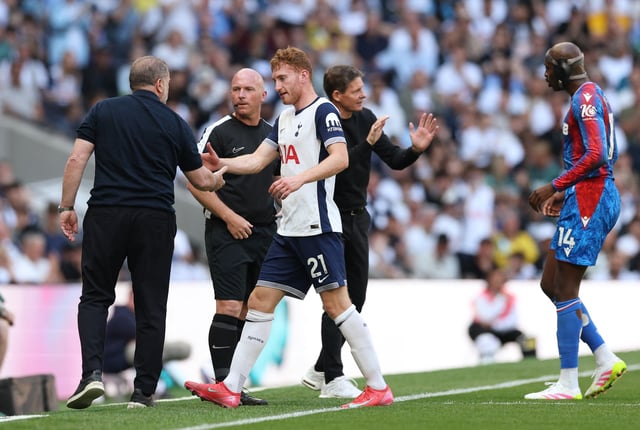 Soccer Football - Premier League - Tottenham Hotspur v Crystal Palace - Tottenham Hotspur Stadium, London, Britain - May 11, 2025 Tottenham Hotspur's Dejan Kulusevski shakes hands with manager Ange Postecoglou after sustaining an injury Action Images via Reuters/Paul Childs/File Photo