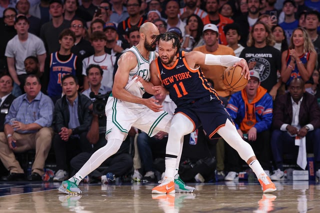 New York Knicks guard Jalen Brunson (11) dribbles as Boston Celtics guard Derrick White (9) defends in the second half during game four of the second round for the 2025 NBA Playoffs at Madison Square Garden.