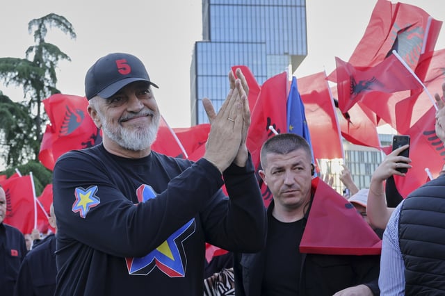 Albanian Prime Minister Edi Rama applauds to his supporters during a celebratory rally for his Socialist Party victory in the last parliamentary elections, in Tirana, Albania, Wednesday, May 14, 2025. (AP Photo/Vlasov Sulaj)