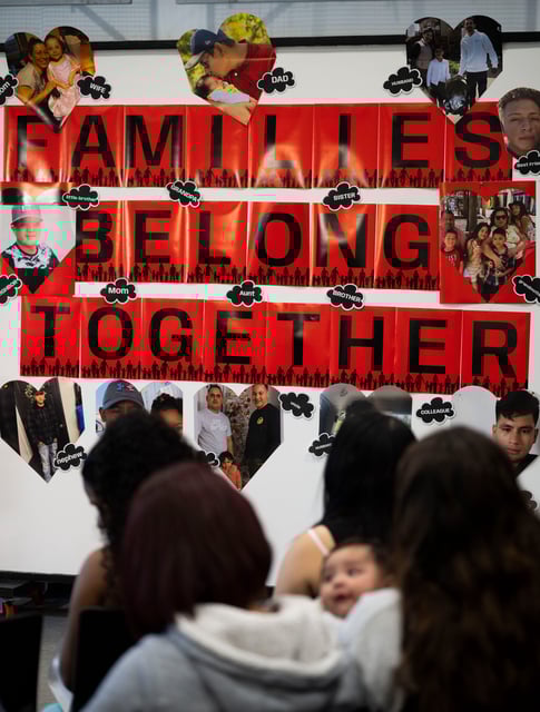 Photographs of people who have been arrested by ICE are displayed on a wall with the words "Families belong together" during a news conference in Nashville, Tenn., Thursday, May 8, 2025. The news conference denounced an immigration enforcement mass traffic sweep that began May 4 in a joint operation between Immigration and Customs Enforcement and the Tennessee Highway Patrol.