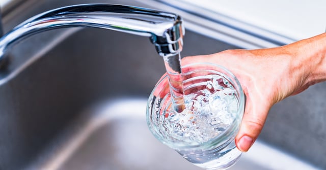A stock photo of drinking water from the tap.