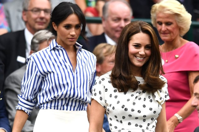 LONDON, ENGLAND – JULY 14:  Meghan, Duchess of Sussex and Catherine, Duchess of Cambridge attend day twelve of the Wimbledon Lawn Tennis Championships at All England Lawn Tennis and Croquet Club on July 14, 2018 in London, England.  (Photo by Clive Mason/Getty Images)