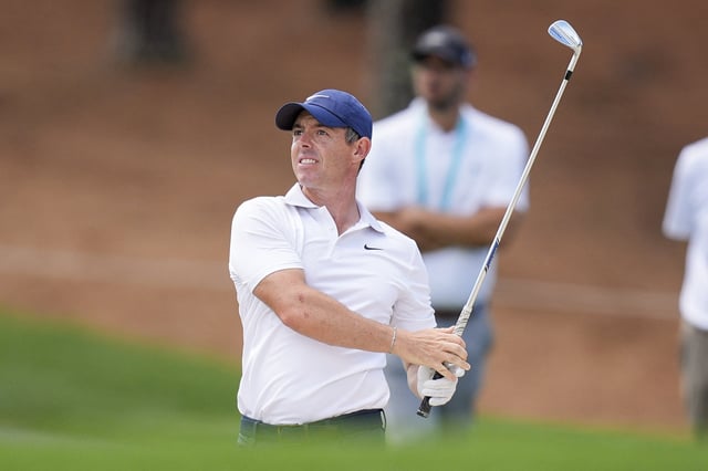 May 13, 2025; Charlotte, North Carolina, USA; Rory McIlroy watches his approach to five green during a practice round for the PGA Championship golf tournament at Quail Hollow. Mandatory Credit: Jim Dedmon-Imagn Images