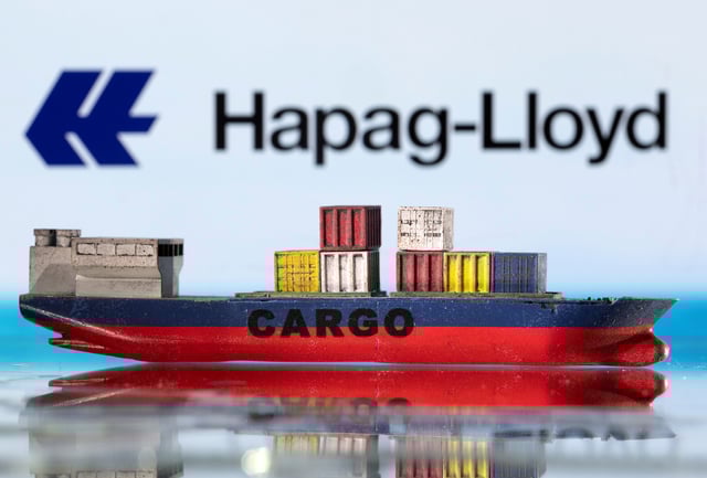A cargo ship boat model is pictured in front of the Hapag-Lloyd logo in this illustration taken March 3, 2022. REUTERS/Dado Ruvic/Illustration/File Photo