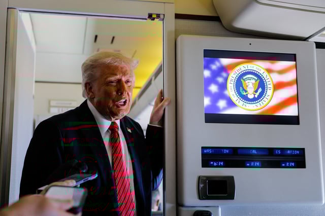 U.S. President Donald Trump speaks to the press on board Air Force One en route to Doha, Qatar, May 14, 2025. REUTERS/Brian Snyder