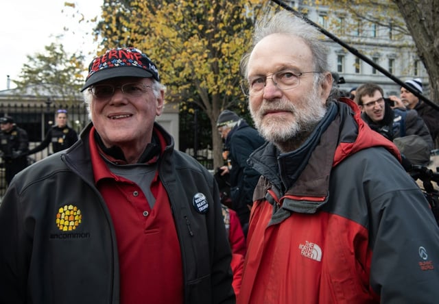 Ben Cohen (L) and Jerry Greenfield, the founders of Ben and Jerry's ice cream, stand outside the White House during a climate rally in Washington, DC on November 8, 2019