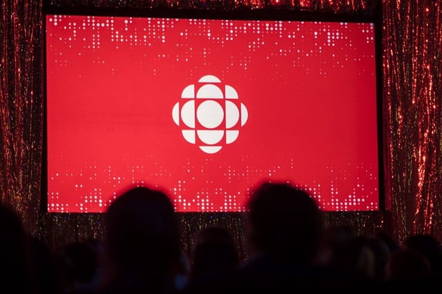 The CBC logo is projected onto a screen in Toronto on May 29, 2019. THE CANADIAN PRESS/Tijana Martin