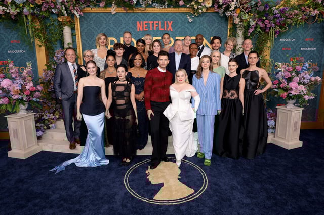 NEW YORK, NEW YORK - MAY 13:  (L-R) Tom Verica, Betsy Beers, Hannah Dodd, Joanna Bobin, Bela Bajaria, Will Tilson, Harriet Cains, Sam Phillips, Shonda Rhimes, Simone Ashley, Jessica Madsen, Ruth Gemmell, Luke Newton, Emma Naomi, Ted Sarandos, Nicola Coughlan, Hannah New, Adjoa Andoh, Daniel Francis, Claudia Jessie, Jess Brownell, Jonathan Bailey, Lorraine Ashbourne, Florence Hunt, Dominic Coleman, and Bessie Carter  attend Netflix&#39;s &#34;Bridgerton&#34; Season 3 World Premiere in NYC at Alice Tully Hall, Lincoln Center on May 13, 2024 in New York City. (Photo by Dimitrios Kambouris/Getty Images for Netflix)