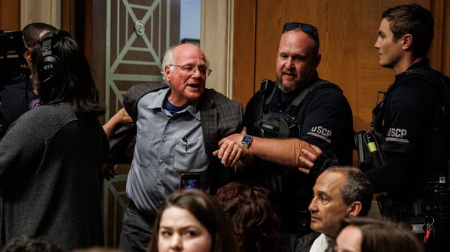 Ben Cohen, co-founder of Ben and Jerry's, is detained by U.S. Capitol Police for disrupting proceedings during a hearing with U.S. Secretary of Health and Human Services Robert F. Kennedy Jr. on Capitol Hill on Wednesday. Photo: Samuel Corum/Getty Images