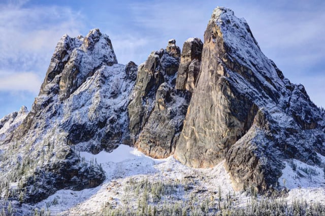A view of the remote Northern Cascades, North Early Winter Spire which is a challenging climb with a sheer rock face, in Washington.
