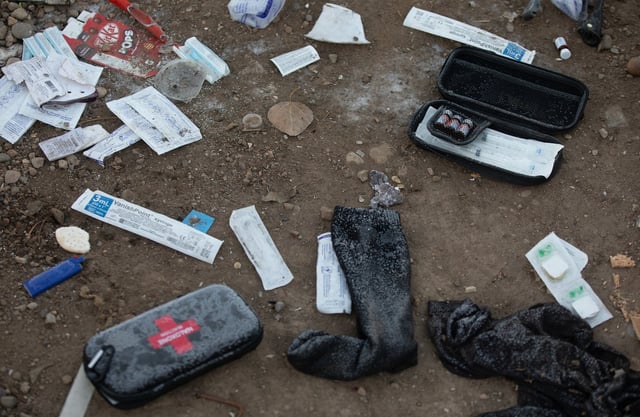 Naloxone kits lie on the ground at a homeless encampment in Edmonton in this file photo from on Friday, Dec. 29, 2023. THE CANADIAN PRESS/Jason Franson