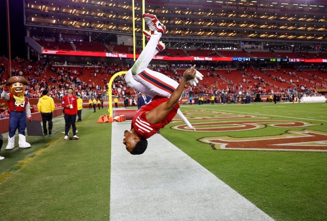 San Francisco 49ers’ Deommodore Lenoir (2) does a backflip after they beat the Dallas Cowboys 30-24 at Levi’s Stadium in Santa Clara, Calif., on Sunday, Oct. 27, 2024. (Nhat V. Meyer/Bay Area News Group)