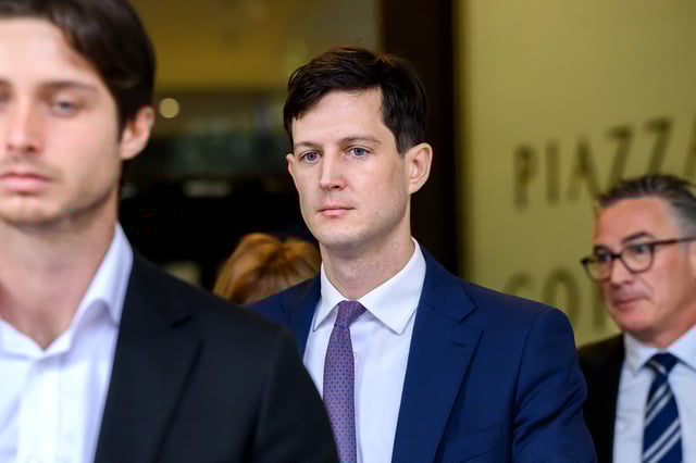 Rory Amon (centre) departs the Downing Centre District Court in Sydney, Friday, April 4, 2025. Former NSW State Liberal MP Rory Amon has been hit with multiple charges for over the alleged sexual abuse of a teenage boy in July 2017. (AAP Image/Bianca De Marchi) NO ARCHIVING