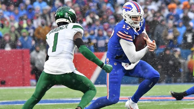 Buffalo Bills quarterback Josh Allen (17) runs the ball against New York Jets cornerback Sauce Gardner (1). Mark Konezny-Imagn Images