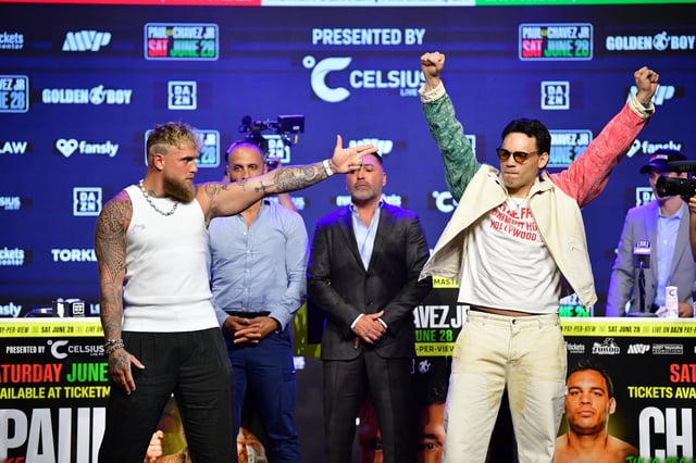 May 14, 2025; Los Angeles, California, USA; Jake Paul and Julio Cesar Chavez Jr. pose for photos following their press conference at Avalon Hollywood Theater. Mandatory Credit: Gary A. Vasquez-Imagn Images