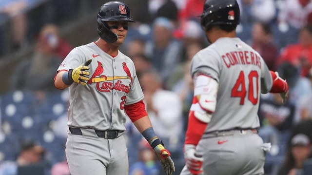 May 14, 2025; Philadelphia, Pennsylvania, USA; St. Louis Cardinals outfielder Lars Nootbaar (21) shakes hands with first base Willson Contreras (40) after scoring during the first inning against the Philadelphia Phillies at Citizens Bank Park. Mandatory Credit: Bill Streicher-Imagn Images
