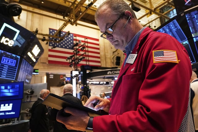 Trader William Lawrence works on the floor of the New York Stock Exchange, Wednesday, May 14, 2025. (AP Photo/Richard Drew)