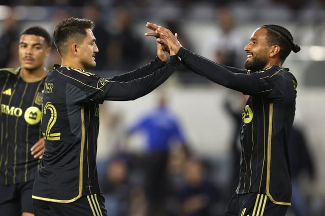 LAFC midfielder Cengiz Ünder, left, celebrates with teammate Eddie Segura after Ünder scored a goal during the first half of their 4-0 victory over the Seattle Sounders on on Wednesday night at BMO Stadium. (Photo by Raul Romero Jr., Contributing Photographer)