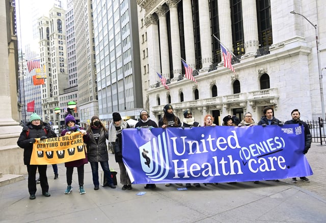Patients and doctors denounce UnitedHealth in a protest on the steps of Wall Street as the company&#39;s record profits were announced on January 16, 2025, in New York City.