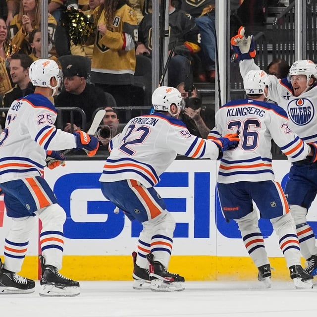Edmonton Oilers right wing Kasperi Kapanen, right, celebrates with teammates after scoring against the Vegas Golden Knights during overtime of Game 5 of a second-round NHL hockey playoff series Wednesday, May 14, 2025, in Las Vegas. (AP Photo/John Locher)