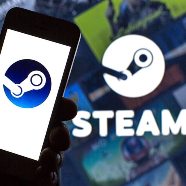 A Steam logo seen displayed on a smartphone and in the background.