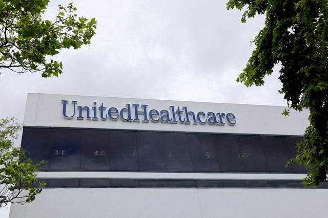 The corporate logo of the UnitedHealth Group appears on the side of one of their office buildings in Santa Ana, California, U.S., April 13, 2020. REUTERS/Mike Blake/File Photo