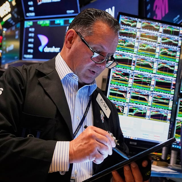 Trader Edward Curran works on the floor of the New York Stock Exchange, Wednesday, May 14, 2025.