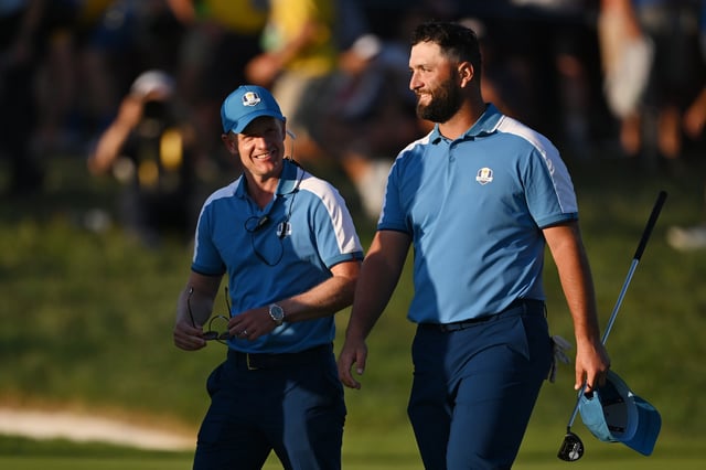 Luke Donald, Captain of Team Europe and Jon Rahm of Team Europe celebrate on the 18th green during the Friday afternoon fourball matches of the 2023 Ryder Cup at Marco Simone Golf Club on September 29, 2023 in Rome, Italy.
