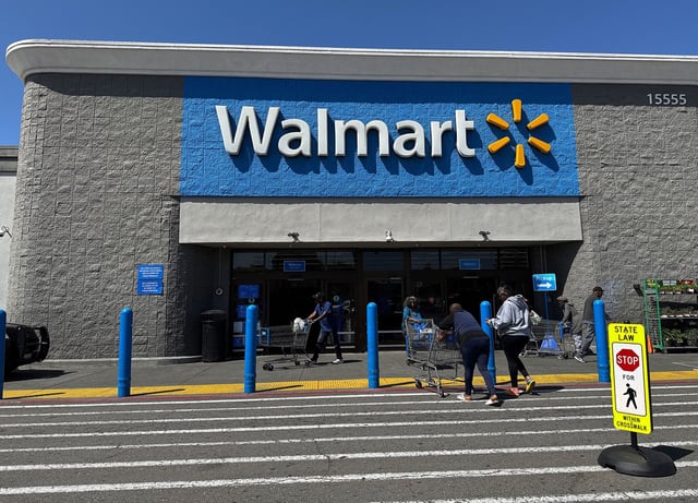 Customers enter a Walmart store on April 9, 2025, in San Leandro, California.