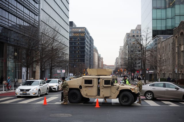 U.S. Army officers park in Washington, D.C., ahead of a rally for President Donald Trump for his inauguration in January.